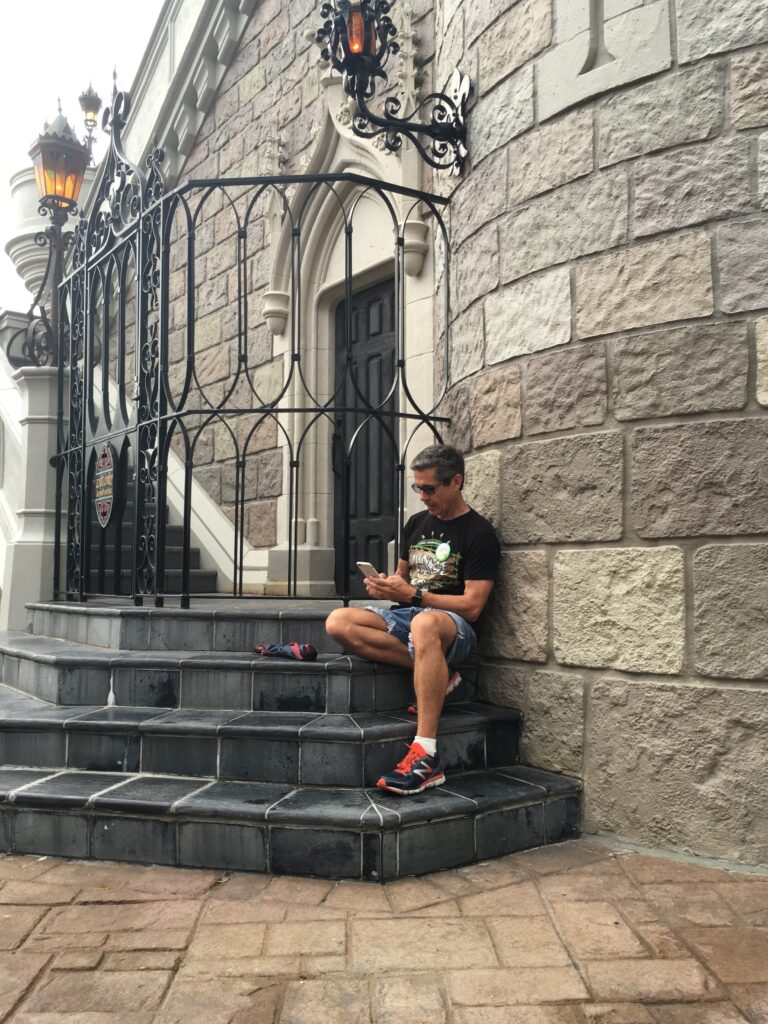Disney Speaker Jeff Noel writing a book on Cinderella Castle steps