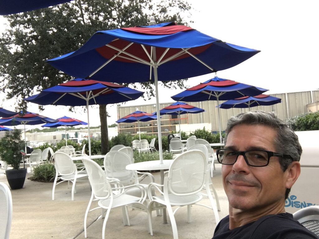 Man sitting at Disney University's outdoor break area