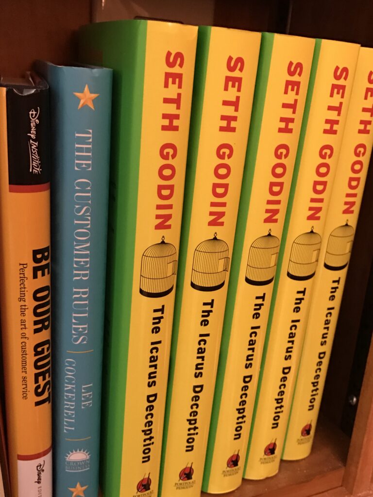 bookshelf with Seth Godin and Disney books