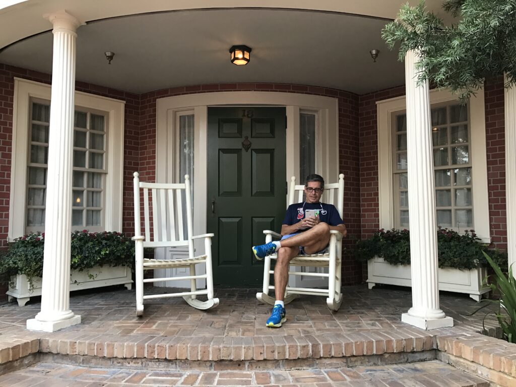 disney speaker Jeff Noel sitting on Magic Kingdom rocking chair